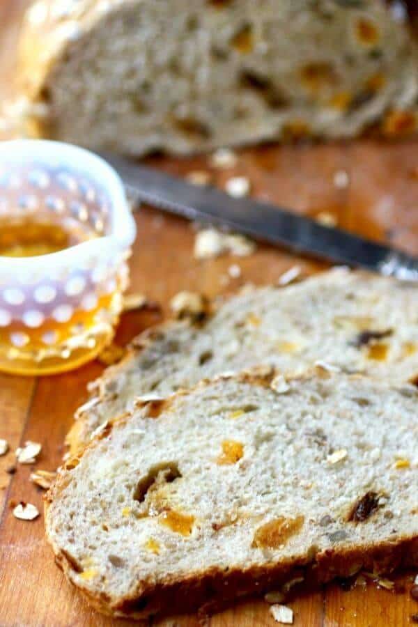 Closeup of a slice of muesli bread showing texture and the fruit in each slice