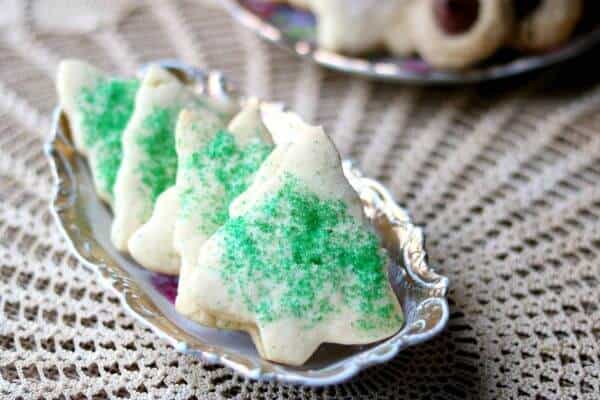 Sugar cookie Christmas trees with green sugar crystals