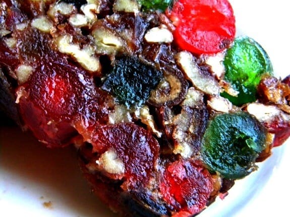 Sliced Christmas Cake close up to show pieces of candied fruit.