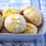 Lemon crackle cookies in a white dish..