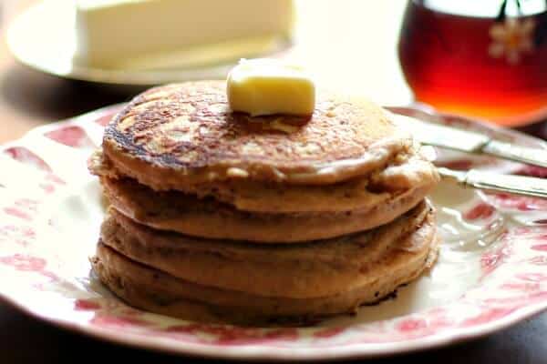 Buckwheat pancakes stacked on a plate.