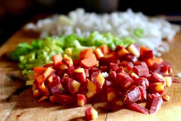 diced carrots, celery, and onion on a cutting booard