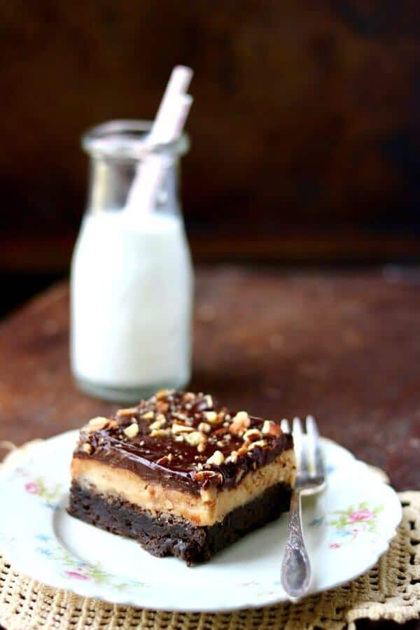 Rich, fudgy brownies are layered with an eggless pecan toffee cookie dough and topped with a dark chocolate ganache. Drool inspiring. From RestlessChipotle.com