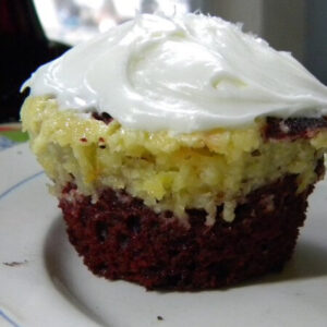 red velvet cupcakes marbled with orange cheesecake