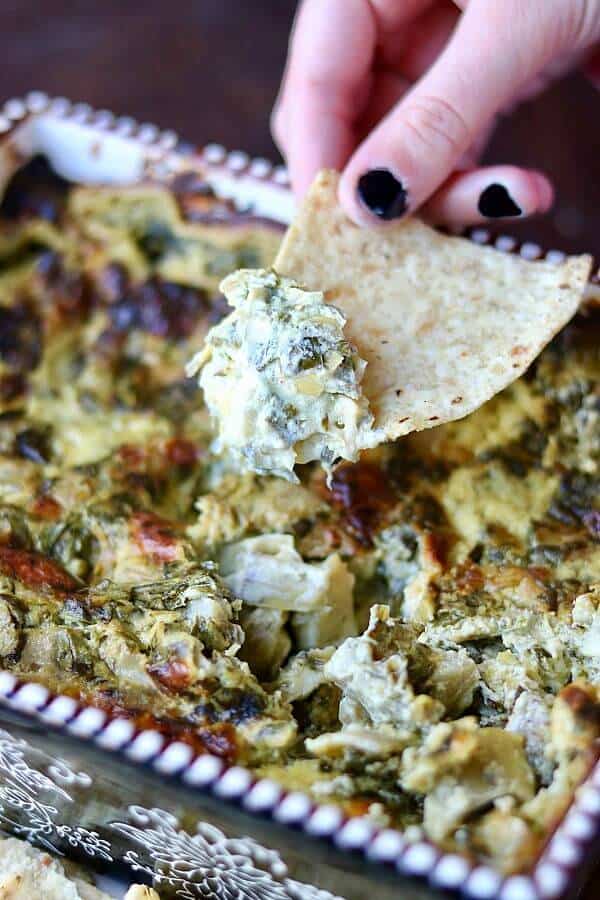 Hot and smoky, this spinach artichoke dip recipe is the best! From RestlessChipotle.com