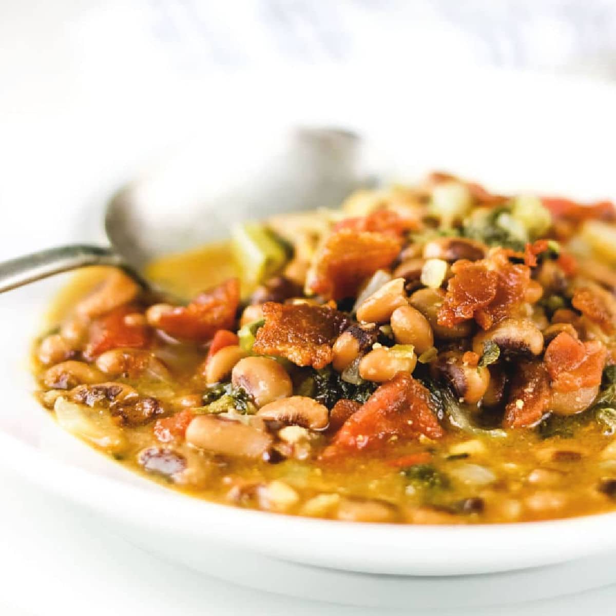 Closeup of a bowl of black eyed pea soup.