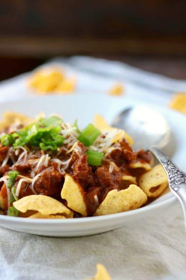 Frito pie is a classic Texas recipe that's quick and easy! This is the original Frito Pie recipe, created by the wife of one of the Fritos executives in the 1950s. From RestlessChipotle.com