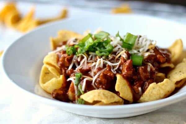 Frito pie is a classic Texas recipe that's found at nearly every high football concession stand. SO quick and easy! From RestlessCHipotle.com
