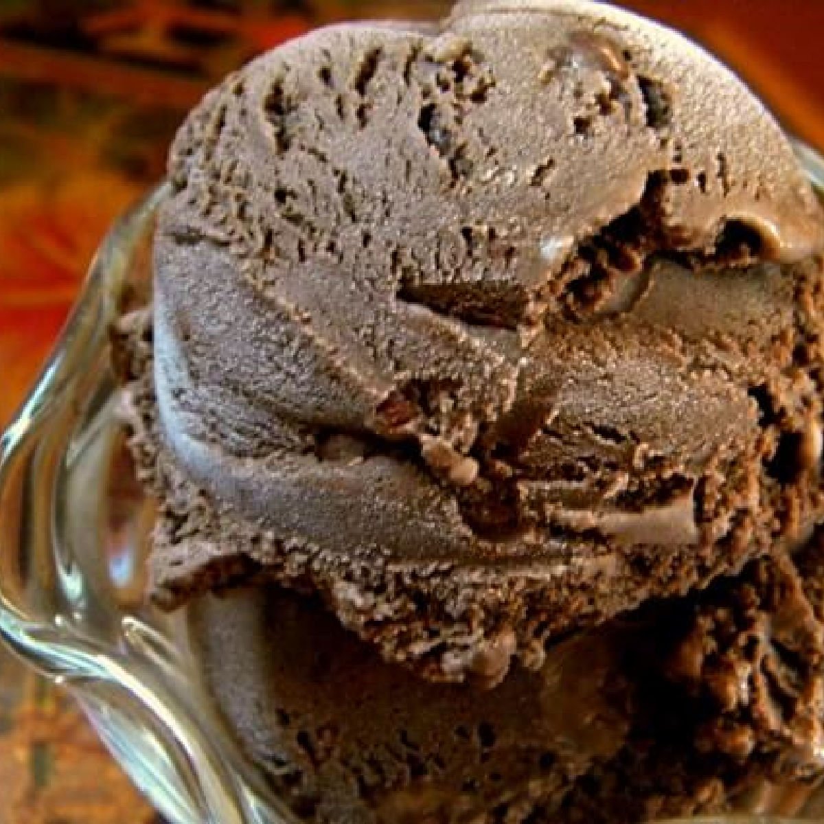 A closeup of a scoop of chocolate chocolate chip ice cream.