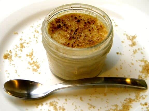 Peanut butter pots de creme on a white plate.