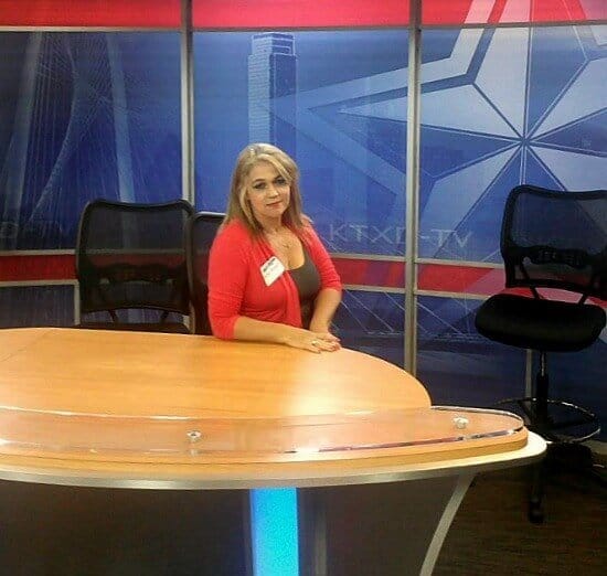 marye audet-white sitting at a table at the television studio