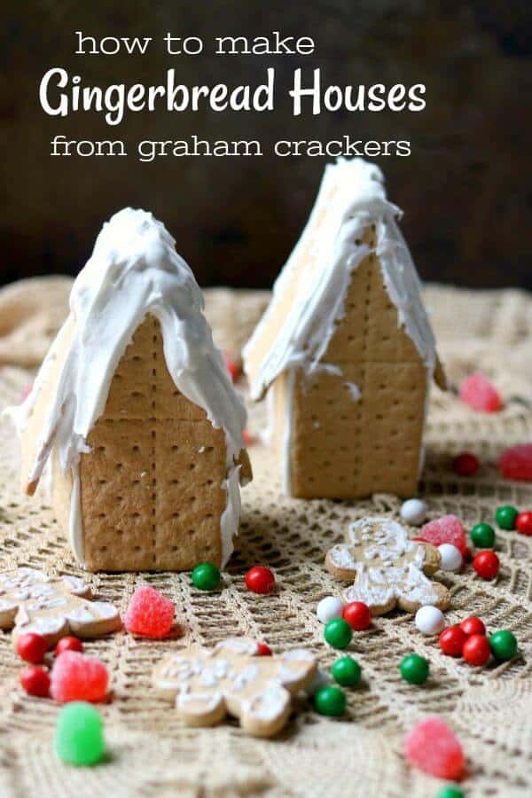 Learn how to make graham cracker gingerbread houses - in this image two are ready to be decorated with red and green candy. Title image.