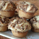 Cinnamon and cream cheese sweet rolls on a plate.