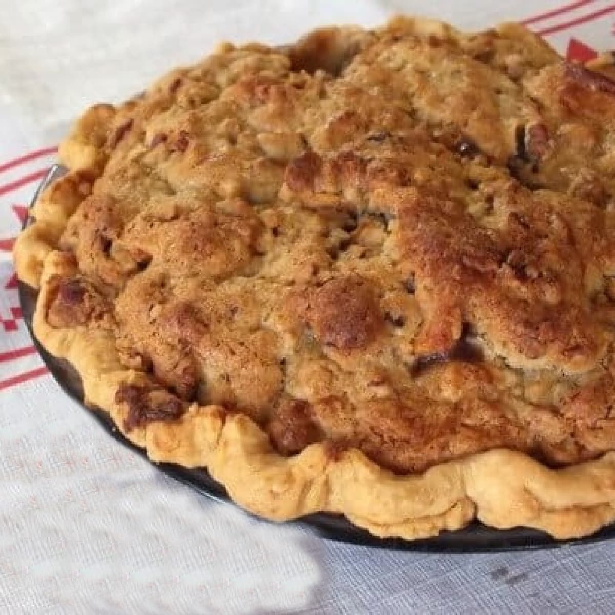 Closeup of a pie with brown sugar topping.