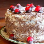Black Forest cake with cherries on top.