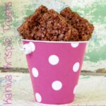Kahlua and chocolate krispie treats in a pink pail.
