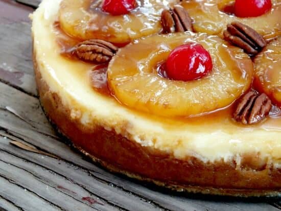 Close up of pineapple topping on cheesecake.