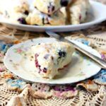 A blueberry scone on a plate.
