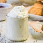 A closeup of a jar of (Devonshire)clotted cream used as the feature image.
