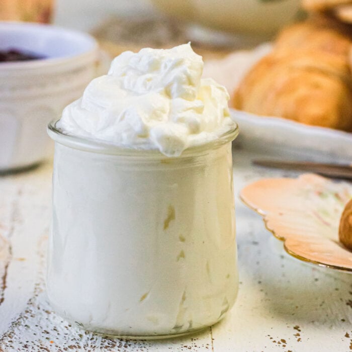 A closeup of a jar of (Devonshire)clotted cream used as the feature image.