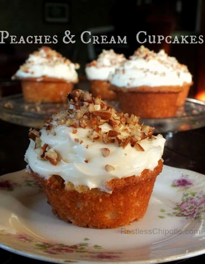 Finished peach cupcakes on a serving dish.
