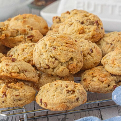 Closeup of the butter pecan toffee cookies on a cooling rack.