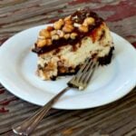 Homemade Snickers Bar Cheesecake with chocolate, caramel, and peanuts.|restlesschipotle.com