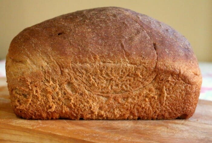 Uncut loaf of whole wheat bread.