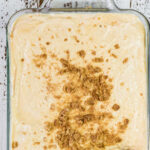 Overhead view of banana pudding with text overlay for Pinterest.