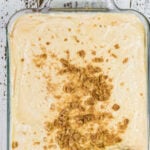 Overhead view of banana pudding with text overlay for Pinterest.