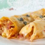 authentic chicken enchiladas in a creamy homemade sauce|restlesschipotle.com