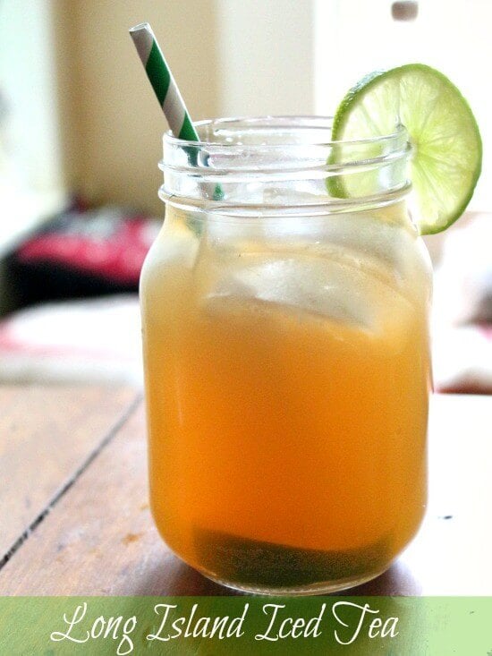 Long island tea cocktail in a mason jar with a green and white striped straw - title image