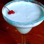 Overhead view of a creamy, blue cocktail.
