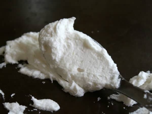 Whipped wedding cake frosting with a light almond flavor - so easy and delicious! RestlessChipotle.com