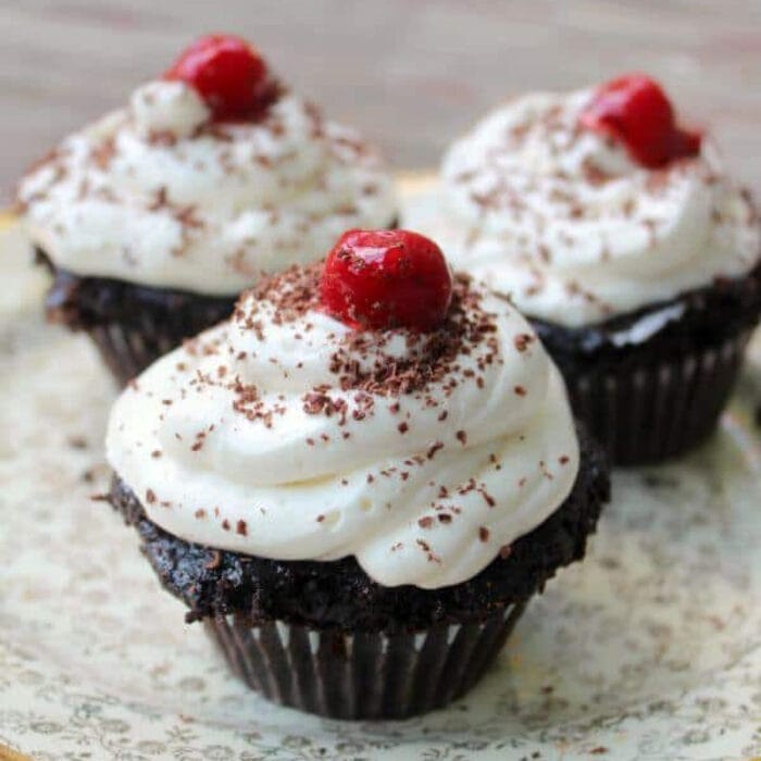 Closeup of Black Forest Cupcakes with cherries on top.