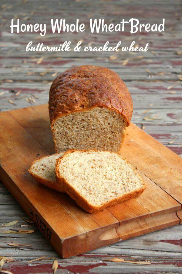 loaf of whole wheat bread on a cutting board with title text overlay.