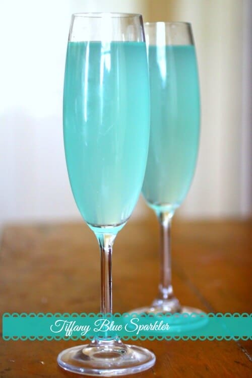 This easy cocktail recipe is perfect for showers, weddings, Valentine's Day or a romantic dinner. Tiffany Blue Sparkler is similar to a Mimosa but so much better! From RestlessChipotle.com