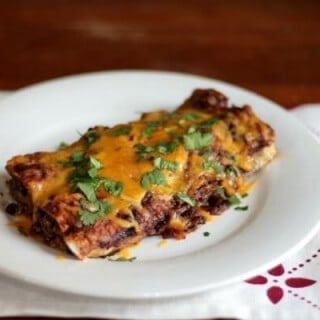 Super easy beef enchiladas - best of all you can make them ahead or freeze them! From RestlessChipotle.com