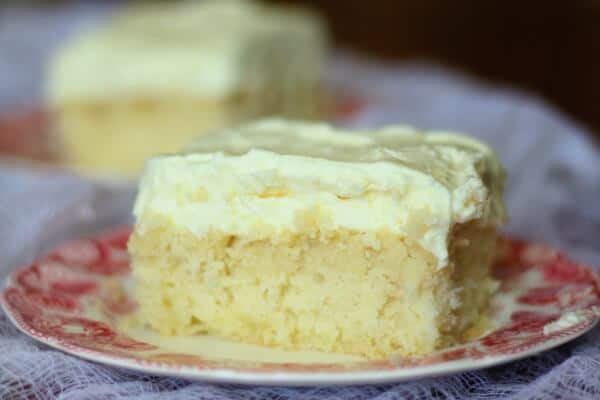 A square of lemon cream cake with fluffly lemon frosting - Easter dessert ideas
