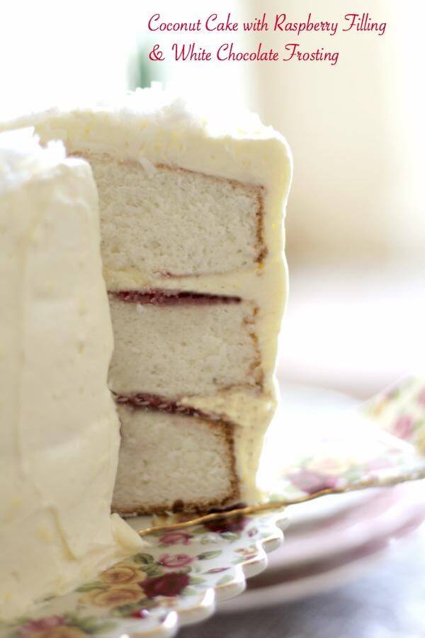 Southern Coconut Cake with tangy raspberry filling and a rich, whipped cream white chocolate frosting. Love this! From RestlessChipotle.com
