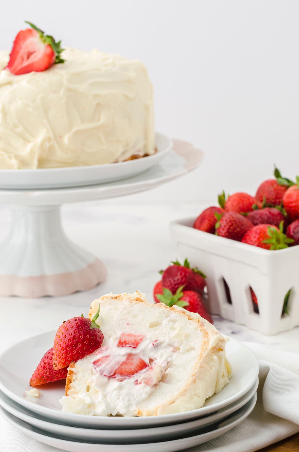 Slice of the filled angel food cake on a plate.