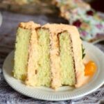Slab of layer cake with thick filling and frosting.