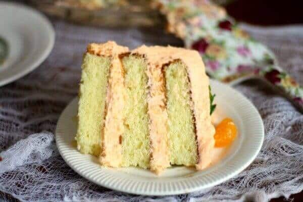 Slab of layer cake with thick filling and frosting.