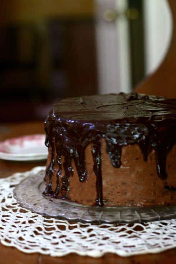 The shadow on this old fashioned chocolate shadow cake is created with ganache. From RestlessChipotle.com