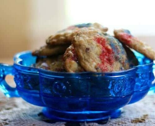 Chewy coconut white chocolate chip cookies are easy to make for summer snacking. From RestlessChipotle.com