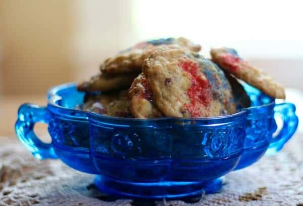 Chewy coconut white chocolate chip cookies are easy to make for summer snacking. From RestlessChipotle.com