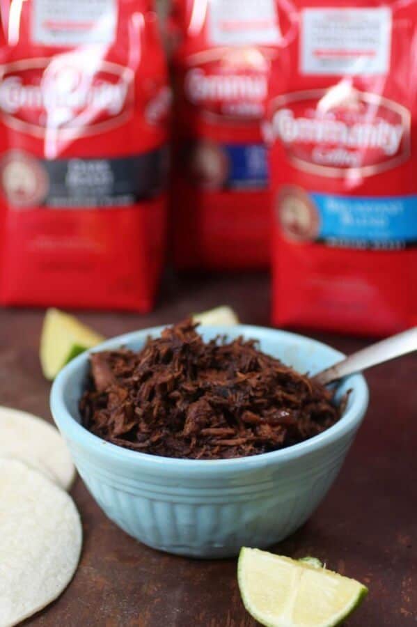 Slow cooked shredded beef, simmered in red eyed gravy spiced up with ancho chile. SO yummy in tortillas or slider buns. From RestlessChipotle.com