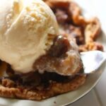 The apples are tender and the streusel has a sweet salty flavor from the bacon in these bourbon apple tarts. From RestlessChipotle.com