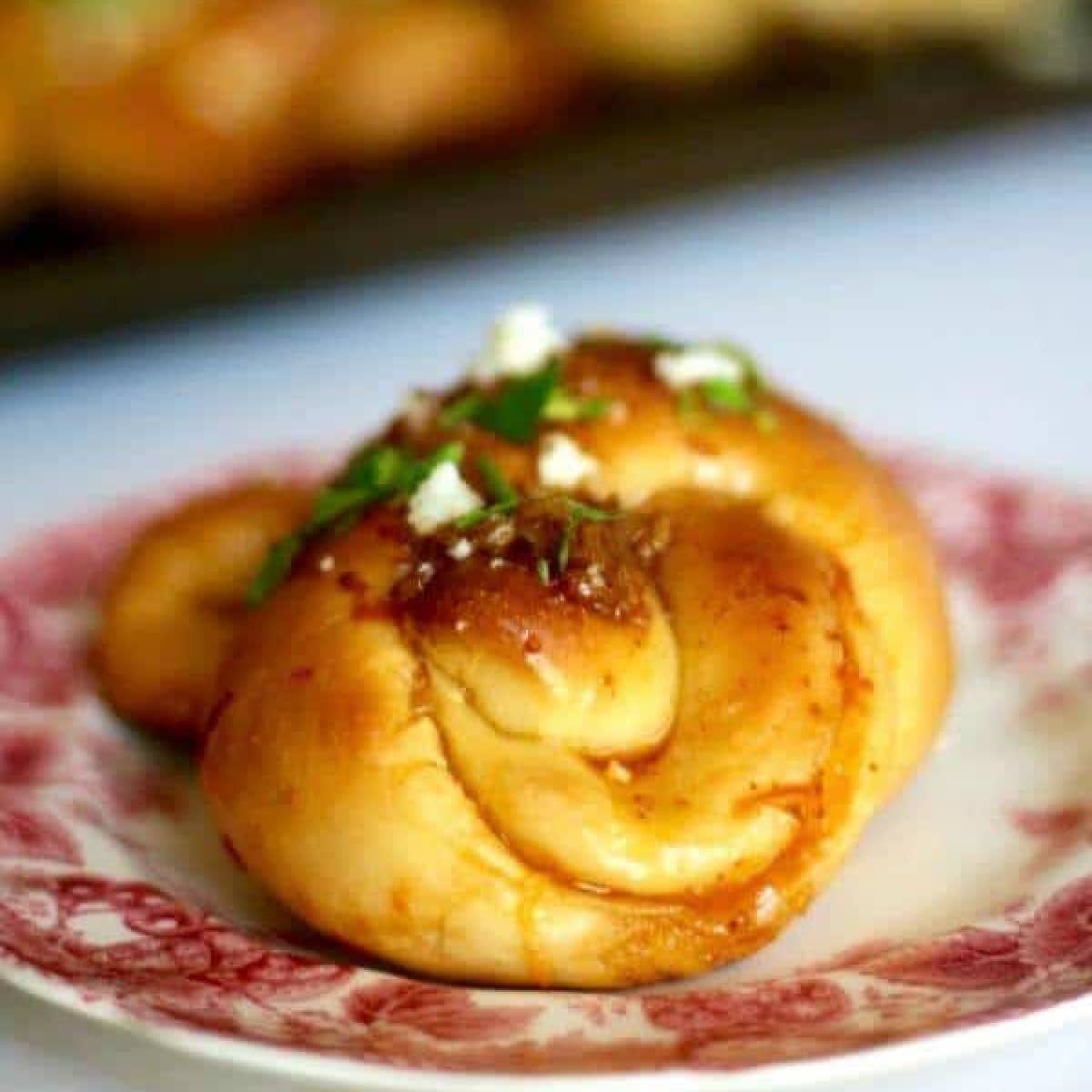 A Texas knot roll on a plate.