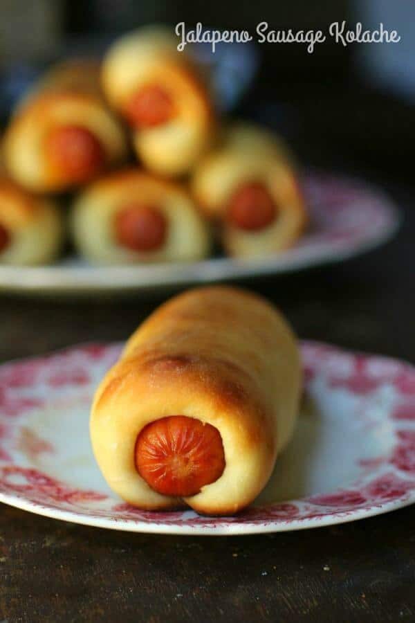 sausage kolache on a plate with title text overlay